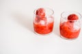 Red berry lemonade in glass jar on a wooden background with lemon slices, honey and ice. Top view Royalty Free Stock Photo