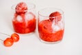 Red berry lemonade in glass jar on a wooden background with lemon slices, honey and ice. Top view Royalty Free Stock Photo