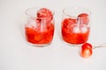 Red berry lemonade in glass jar on a wooden background with lemon slices, honey and ice. Top view Royalty Free Stock Photo