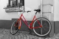 Red bicycle on cobblestone street in the old town, Black And White Royalty Free Stock Photo