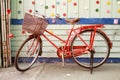 Red bicycle and colorful wood wall Royalty Free Stock Photo