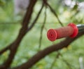 Red bicycle handle on a green landscape background. Royalty Free Stock Photo