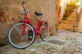 Red Bicycle on the Narrow Street of the Old City Royalty Free Stock Photo