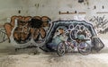 A red bicycle is parked beside the graffiti patterns on the wall Royalty Free Stock Photo