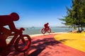 Red bicycle sculpture on the beach