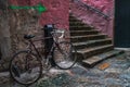 Red bicycle in the street of an old stone little town