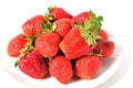 Red big strawberries in a white plate on a white background with water drops on berries isolate Royalty Free Stock Photo