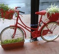 Red bike in Italy with flowers