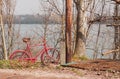 Red bike parking near the river Royalty Free Stock Photo