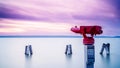 Red binocular on sea shore Royalty Free Stock Photo