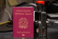 Red biometric passport of a Italian citizen with a border date stamper, close-up. Inscription - European Union, Italian Republic,