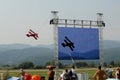 The red biplane - Slovac air show The big screen Royalty Free Stock Photo
