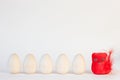 Red bird and wooden eggs Royalty Free Stock Photo