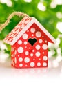 Red birdhouse in white polka dot Royalty Free Stock Photo