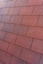Red Bituminous Roof Shingle Texture Background with Granular Surface Royalty Free Stock Photo