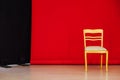 Red black background room and golden chair