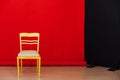 Red black background room and golden chair