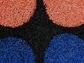 Red black and blue granular textured rubber safety floor pattern