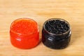 Red and black caviar in a glass jar Royalty Free Stock Photo