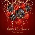 Red and black Christmas balls and golden streamers on knitted ba Royalty Free Stock Photo