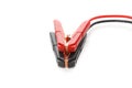 Red and black cooper jumper cable isolated on white background. Power supply wire for car battery