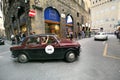 Red/Black Fiat 1100 TV, 1957, drives in Florence during 1000 Miglia