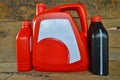 Red and black gallons of motor oil Royalty Free Stock Photo