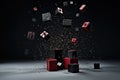 Red and black gift boxes with bow on festive dark background with copy space and confetti. Royalty Free Stock Photo