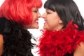 Red and Black Haired Women Smiling at Each Other Royalty Free Stock Photo