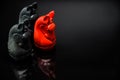 Red and Black Knight Thai chess pieces with black background and selective focus Royalty Free Stock Photo