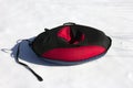 Red and black material snow inner tubing on the white Royalty Free Stock Photo