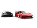 Red and black modern super sport cars - red in the lead