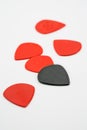 Red and black plastic guitar picks isolated on white Royalty Free Stock Photo