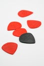 Red and black plastic guitar picks isolated on white Royalty Free Stock Photo