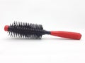 Red and Black Plastic Hair Comb for Brushing Fashion and Beauty Appliances in White Isolated Background 01 Royalty Free Stock Photo