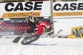 Red and Black Polaris Snowmobile crashing down