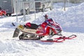 Red and Black Polaris Snowmobile After the Race