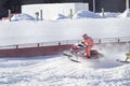 Red and Black Polaris Snowmobile Racing over jump