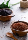 Red and black rice in bowls. Royalty Free Stock Photo