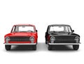 Red and black soviet era vintage cars side by side - front view