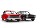 Red and black soviet era vintage cars side by side