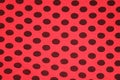 Red with black spots textile texture