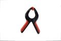 Red and black spring clamp Royalty Free Stock Photo