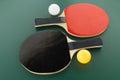 Red and black table tennis racks with balls Royalty Free Stock Photo