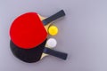 Red and black table tennis racks with balls Royalty Free Stock Photo