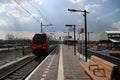 Red and black train on station Waddinxveen Triangel of R-NET, a light rail train between alphen and gouda