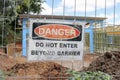 Red, black and white Danger, Do No Enter Beyond Barrier warning sign at building and construction site Royalty Free Stock Photo