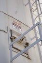 A red, black and white metal Danger Confined Space warning sign on a structure exterior wall Royalty Free Stock Photo