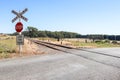 Red, black and white Stop, Look For Trains, Railway Crossing warning signs at railway tracks in rural Australia Royalty Free Stock Photo