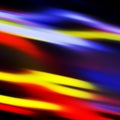 Red black white yellow blue gray fluid lines, texture blurred background Royalty Free Stock Photo